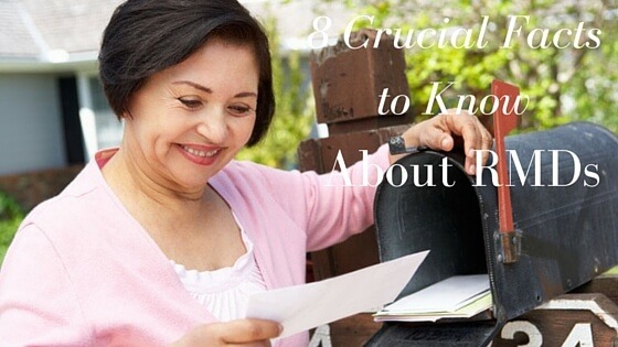 Asian woman reading letter out of mailbox